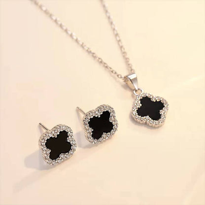 Elegant Silver & Black Clover Jewelry Set – Necklace & Earrings